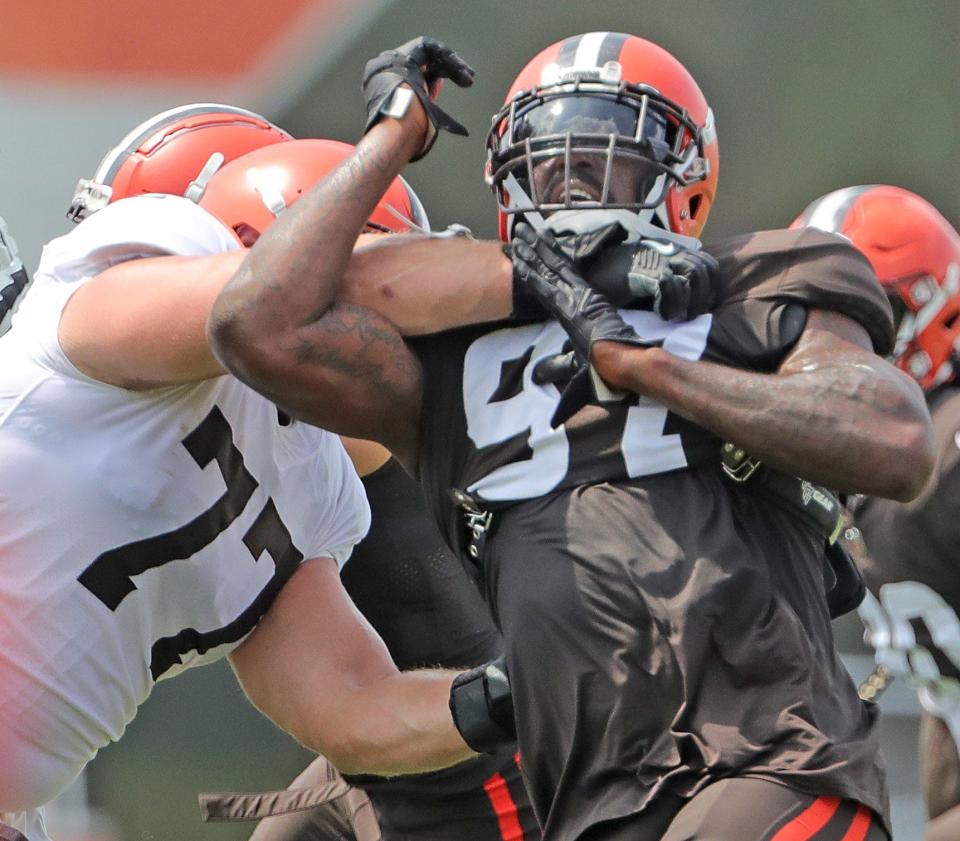 Browns defensive tackle Malik Jackson, right, goes up against offensive guard Wyatt Teller in 11 on 11 drills on Friday, August 6, 2021 in Berea, Ohio, at CrossCountry Mortgage Campus. [Phil Masturzo/ Beacon Journal]