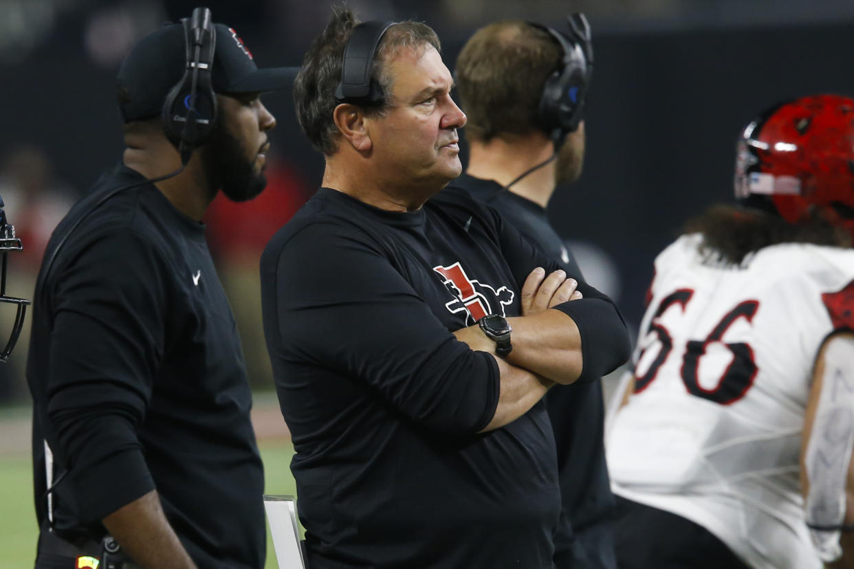 San Diego State coach Brady Hoke watches during the first half of the team's NCAA college football game against UNLV on Friday, Nov. 19, 2021, in Las Vegas. (AP Photo/Chase Stevens)