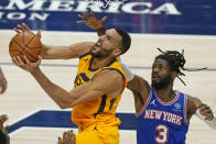 Utah Jazz center Rudy Gobert, left, lays the ball up as New York Knicks center Nerlens Noel (3) defends in the second half during an NBA basketball game Tuesday, Jan. 26, 2021, in Salt Lake City. (AP Photo/Rick Bowmer)