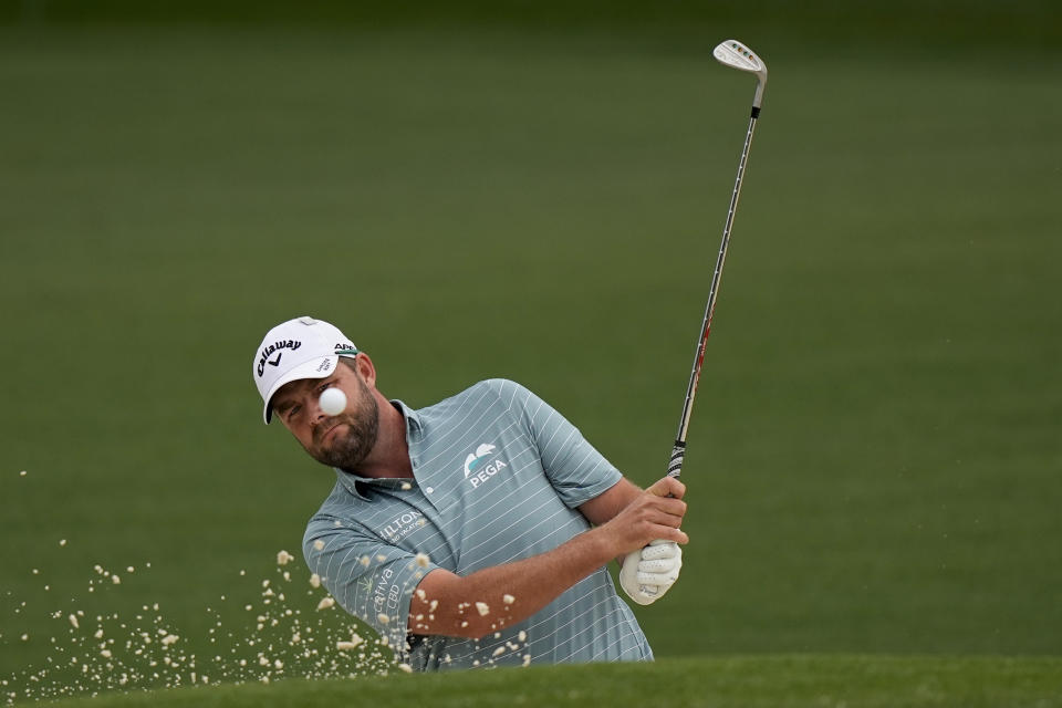 Marc Leishman, of Australia, hits out of a bunker on the second hole during the second round of the Masters golf tournament on Friday, April 9, 2021, in Augusta, Ga. (AP Photo/David J. Phillip)