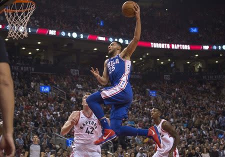 FILE PHOTO: Philadelphia 76ers guard Ben Simmons (25) drives to the basket over Toronto Raptors center Jakob Poeltl (42) in the first quarter at Air Canada Centre, Oct 21, 2017; Toronto, Ontario, CAN. Mandatory Credit: Nick Turchiaro-USA TODAY Sports