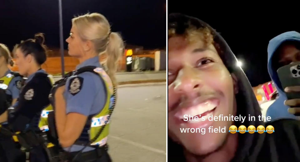Young men laughing at a female police officer on duty