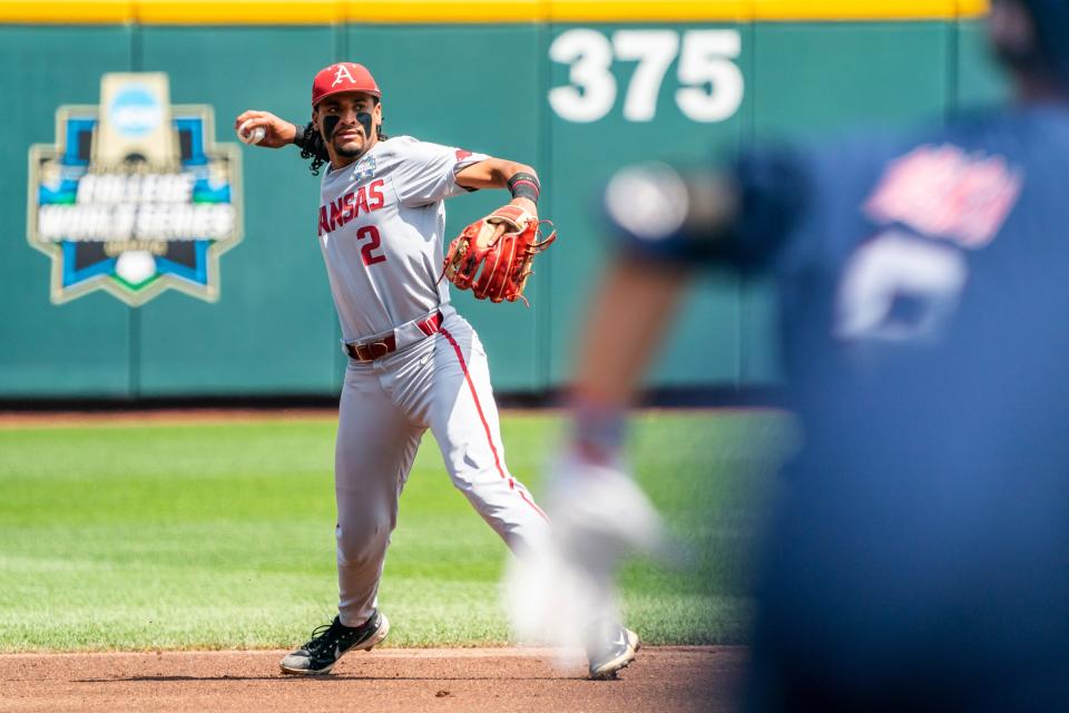 Jun 23, 2022; Omaha, NE, USA; Arkansas Razorbacks shortstop Jalen Battles (2) throws to first base against the Ole Miss Rebels during the first inning at Charles Schwab Field. Mandatory Credit: Dylan Widger-USA TODAY Sports