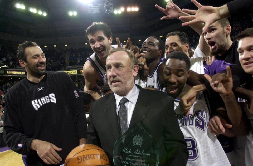Sacramento Kings coach Rick Adelman is mobbed by his players – including Vlade Divac, Peja Stojakovic, Chris Webber, Doug Christie and Jabari Smith – after the coach’s 500 career victory, against the Orlando Magic at Arco Arena on Tuesday, Dec. 11, 2001. Hector Amezcua/Sacramento Bee file