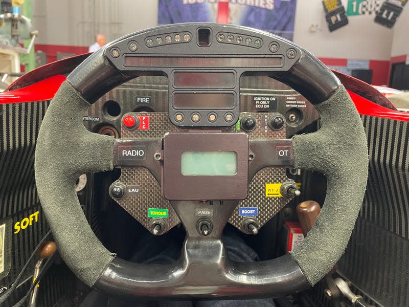 Sèbastian Bourdais' Steering Wheel in his 2006 championship-winning Newman/Haas Racing car. Water button reads "eau" in French.