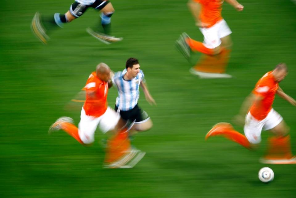 The Netherlands battle to contain Lionel Messi during their 2014 World Cup semi-final against Argentina.