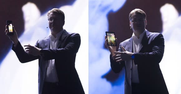Samsung executive showcasing the new foldable OLED Galaxy X smartphone.