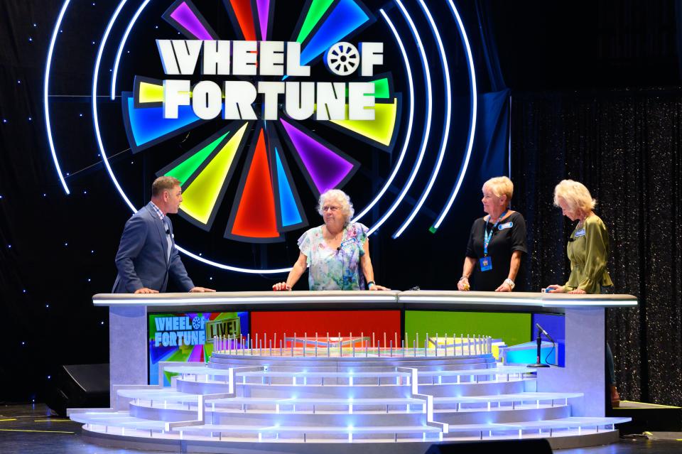 Mark L. Walberg hosts a live version of “Wheel of Fortune” at the Van Wezel Performing Arts Hall, where audience members have a chance to compete for prizes.