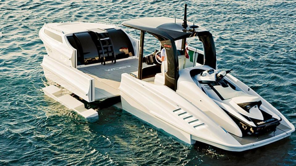 Introduced in 2011, the 42 started the current expandable hull craze. Note the jet ski at the transom. - Credit: Courtesy Wider Yachts
