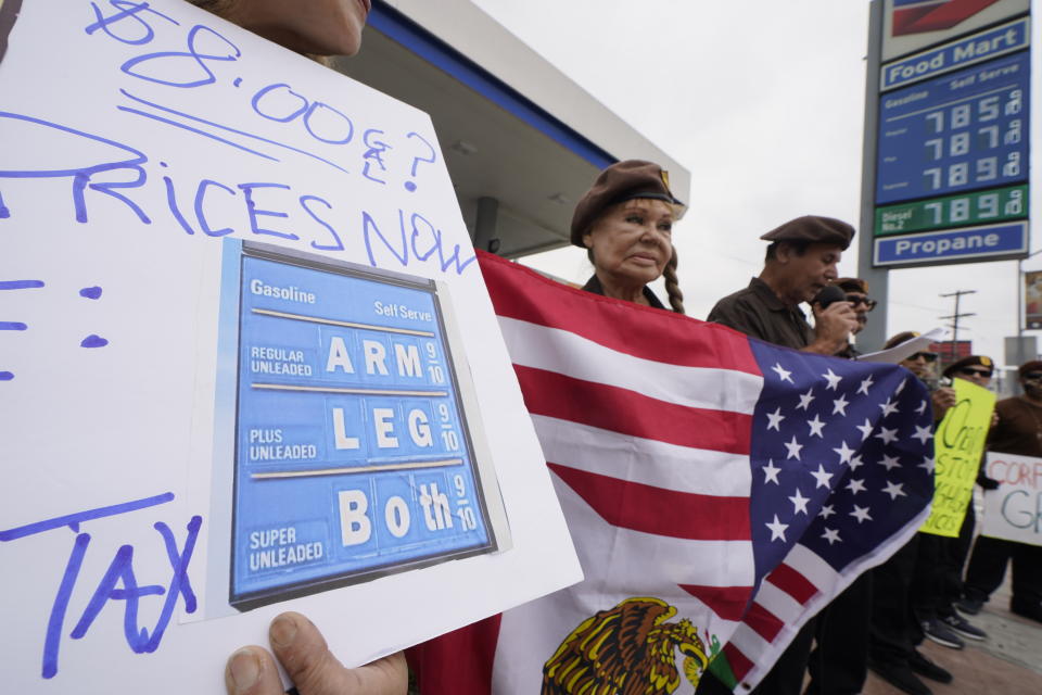 Members of the Brown Beret National Party protest high gasoline prices at a Chevron gas station downtown Los Angeles, Saturday, June 4, 2022 in Los Angeles. (AP Photo/Damian Dovarganes)