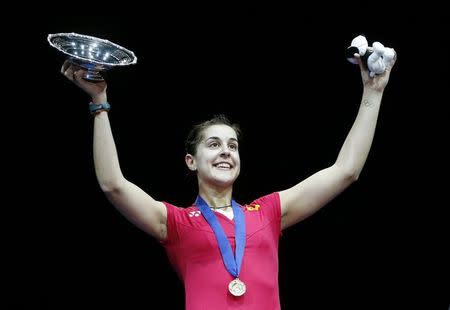 Badminton - Yonex All England Open Badminton Championships 2015 - The National Indoor Arena, Birmingham - 8/3/15 Spain's Carolina Marin poses for photographers on the podium after victory in the women's singles final Action Images via REUTERS/Peter Cziborra