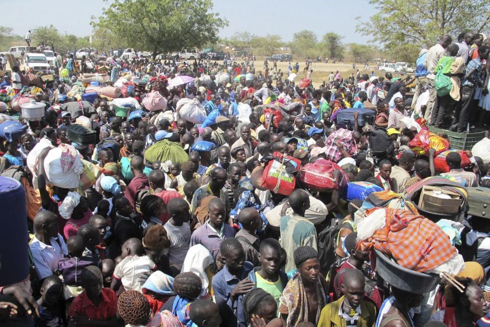 Civilians arrive for shelter at the United Nations Mission in the Republic of South Sudan compound in Bor, South Sudan