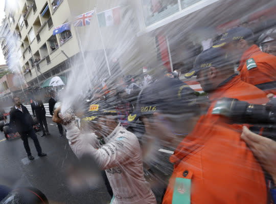 <p>Mercedes driver Lewis Hamilton of Britain sprays champagne as he celebrates his win at the Monaco Formula One Grand Prix in Monaco, Sunday, May 29, 2016. <em>(AP Photo/Claude Paris)</em> </p>