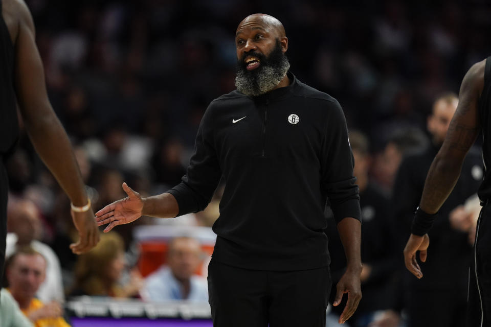 Brooklyn Nets head coach Jacque Vaughn talks to his team in the first half of an NBA basketball game against the Charlotte Hornets, Monday, Oct. 30, 2023, in Charlotte, N.C. (AP Photo/Erik Verduzco)