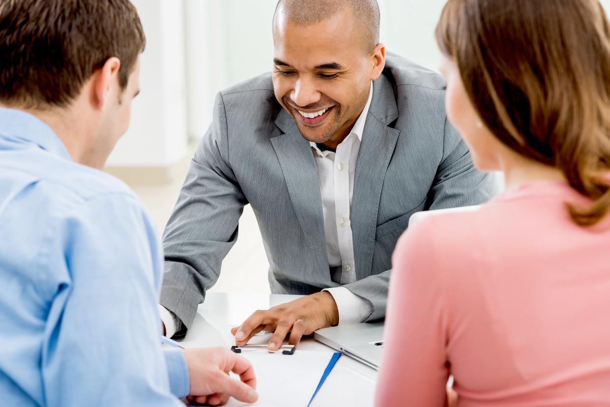 couple meeting with their financial advisor