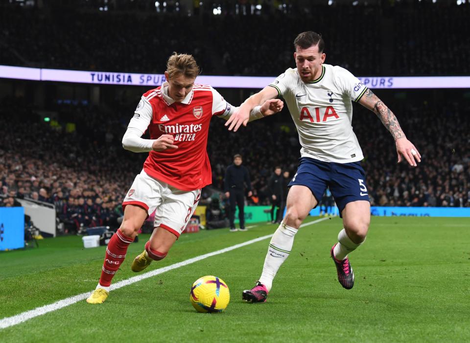 LONDON, ENGLAND - JANUARY 15: Martin Odegaard of Arsenal takes on Pierre-Emile Hojbjerg during the Premier League match between Tottenham Hotspur and Arsenal FC at Tottenham Hotspur Stadium on January 15, 2023 in London, England. (Photo by Stuart MacFarlane/Arsenal FC via Getty Images)