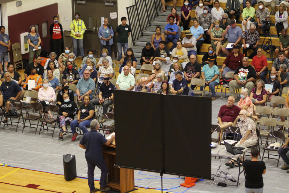 Residents of Pahala, Hawaii, a remote town of about 1,400 on the south side of the Big Island, listen as Civil Defense Administrator Talmadge Magno speaks about the recent activity on Mauna Loa at the local gymnasium on Thursday, Oct. 27, 2022. The ground is shaking and swelling at Mauna Loa, the largest active volcano in the world, indicating that it could erupt. Scientists say they don't expect that to happen right away but officials on the Big Island of Hawaii are telling residents to be prepared. (AP Photo/Megan Moseley)