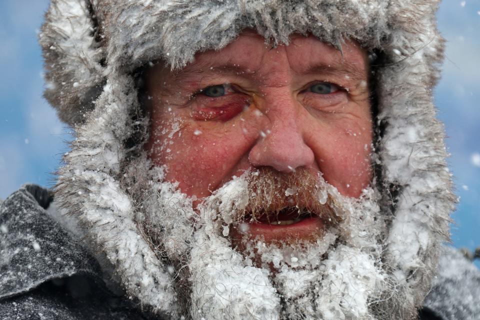 A reporter from the Rochester Democrat and Chronicle estimated 70% of the seats are encased in snow as of Monday at noon ET. Shown here is one of the workers who shoveled at Highmark Stadium on Sunday.