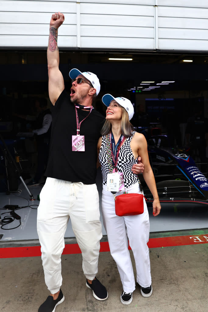 SPIELBERG, AUSTRIA - JULY 10: Dax Shepard and Kristen Bell pose for a photo outside the Williams garage ahead of the F1 Grand Prix of Austria at Red Bull Ring on July 10, 2022 in Spielberg, Austria. (Photo by Lars Baron - Formula 1/Formula 1 via Getty Images)