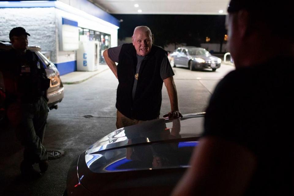 Bail bondsman Woody Fox debriefs with his team in 2018 in Columbus. In lieu of waiting in jail until trial, accused offenders who cannot afford to post bail can retain the services of a bondsman who will cover the amount for them.