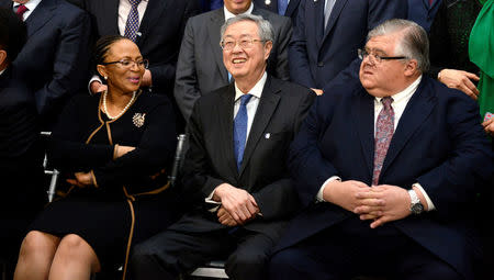 People's Bank of China Governor Zhou Xiaochuan (C) is seated with Central Bank of Lesotho Governor Rets'elisitoe Adelaide Matlanyane (L) and Mexico's Finance Minister Agustin Carstens for a "family" photo for the International Monetary and Financial Committee (IMFC), as part of the IMF and World Bank's 2017 Annual Spring Meetings, in Washington, U.S., April 22, 2017. REUTERS/Mike Theiler