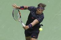 Rafael Nadal of Spain hits a backhand to Borna Coric of Croatia during their match at the U.S. Open Championships tennis tournament in New York, August 31, 2015. REUTERS/Shannon Stapleton