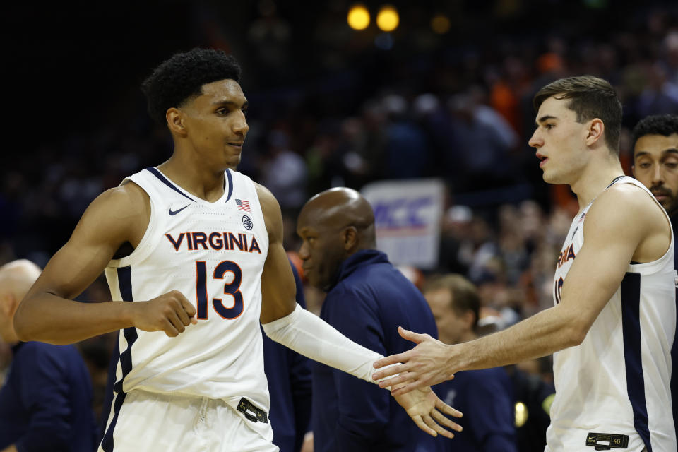 Nov 29, 2023; Charlottesville, Virginia, USA; Virginia Cavaliers guard Ryan Dunn (13) celebrates with Virginia Cavaliers guard <a class="link " href="https://sports.yahoo.com/ncaab/players/163153" data-i13n="sec:content-canvas;subsec:anchor_text;elm:context_link" data-ylk="slk:Taine Murray;sec:content-canvas;subsec:anchor_text;elm:context_link;itc:0">Taine Murray</a> (10) after their game against the Texas A&M Aggies at John Paul Jones Arena. Geoff Burke-USA TODAY Sports