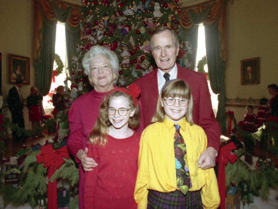 George H. W. Bush with his wife, Barbara, with their grandchildren Jenna and Barbara