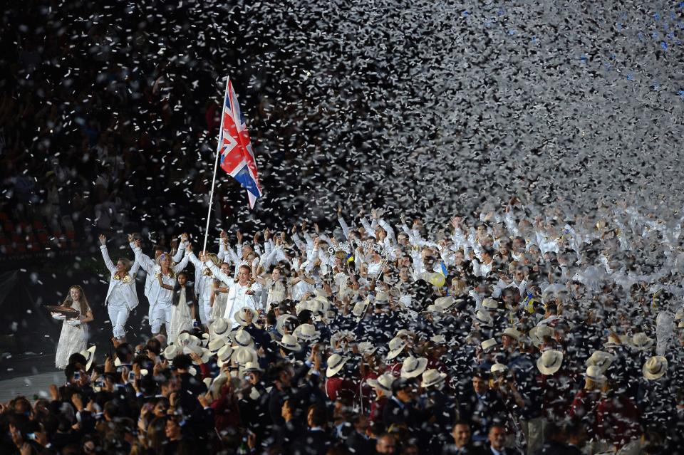 Sir Chris Hoy of the Great Britain Olympic cycling team carries his country's flag during the opening ceremony of the London 2012 Olympic Games.