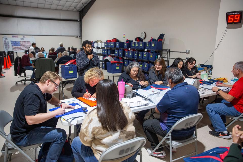 Volunteers help count ballots during election night on Tuesday, Nov. 7, 2023, at the Doña Ana County Bureau of Elections Warehouse.