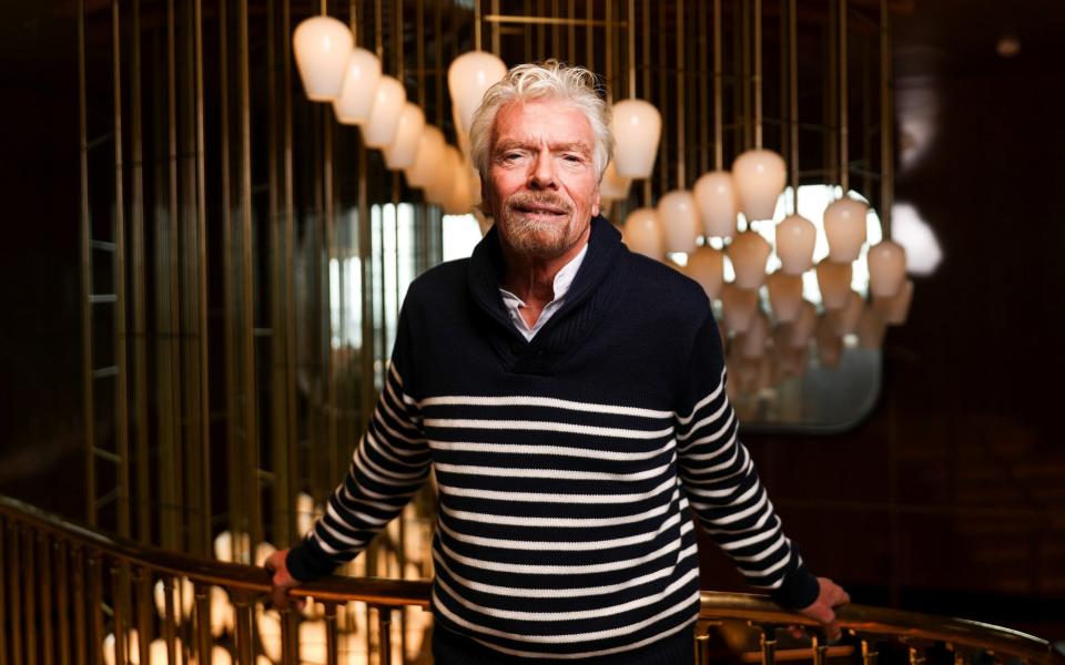 Richard Branson pictured on board his new liner - Simon Dawson/Reuters