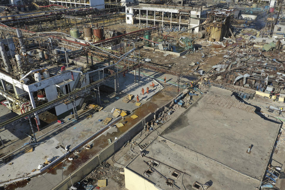 In this aerial photo released by China's Xinhua News Agency, rescuers work at the site of a factory explosion in a chemical industrial park in Xiangshui County of Yancheng in eastern China's Jiangsu province, Friday, March 22, 2019. The local government reports the death toll in an explosion at a chemical plant in eastern China has risen with dozens killed and more seriously injured. (Ji Chunpeng/Xinhua via AP)