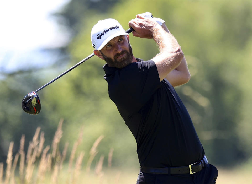Dustin Johnson watches his tee shot on the seventh hole during the second round of the Portland Invitational LIV Golf tournament in North Plains, Ore., Friday, July 1, 2022. (AP Photo/Steve Dipaola)