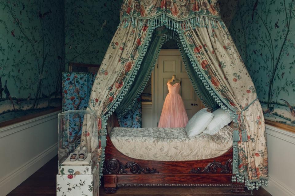 A 1950s pink dress owned by the Dowager Duchess of Devonshire inside the Regency Guest Rooms at Chatsworth (India Hobson)