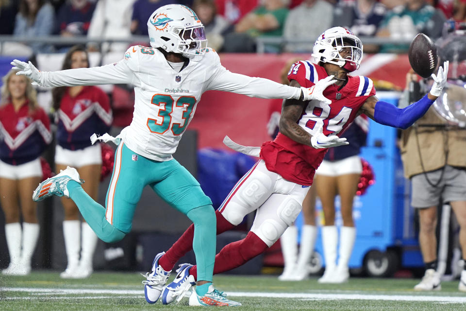 Miami Dolphins cornerback Eli Apple (33) pressures New England Patriots wide receiver Kendrick Bourne (84) on an incomplete pass during the first half of an NFL football game, Sunday, Sept. 17, 2023, in Foxborough, Mass. (AP Photo/Steven Senne)