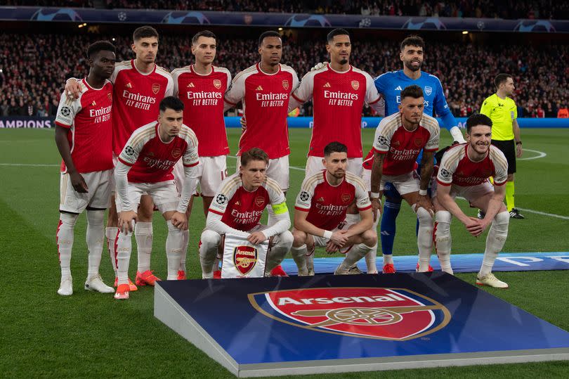 Arsenal players line up before a Champions League game