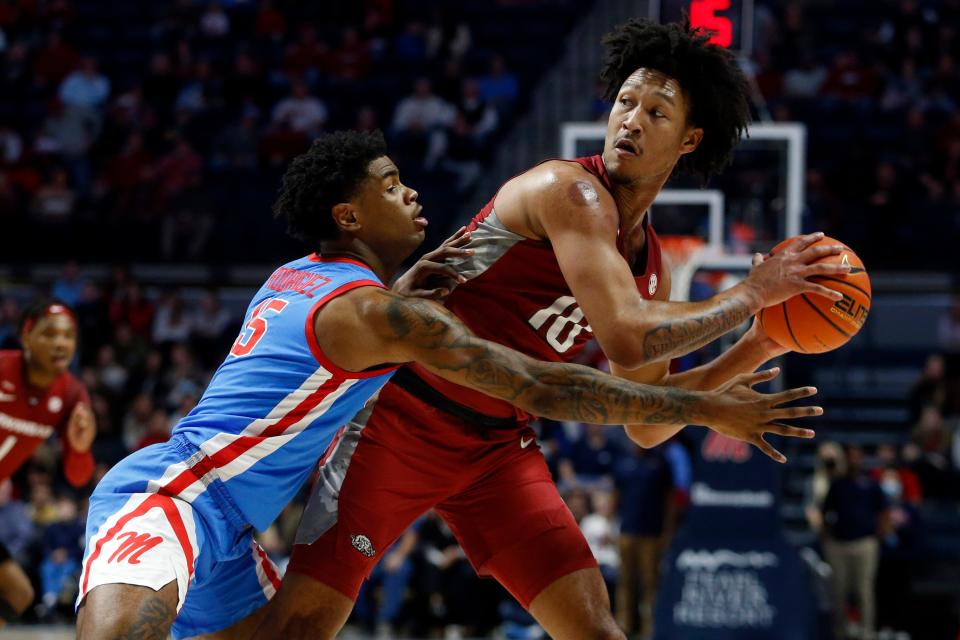 Jan 26, 2022; Oxford, Mississippi, USA; Arkansas Razorbacks forward Jaylin Williams (10) looks for an open lane as Mississippi Rebels guard-forward Luis Rodriguez (15) defends during the first half at The Sandy and John Black Pavilion at Ole Miss. Mandatory Credit: Petre Thomas-USA TODAY Sports