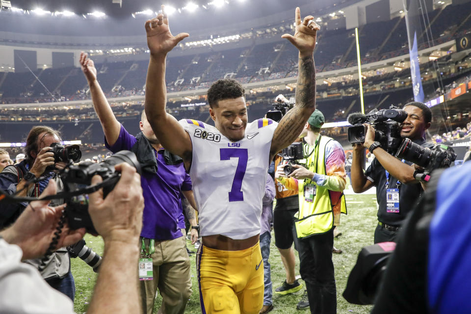 NEW ORLEANS, LA - JANUARY 13: Safety Grant Delpit #7 of the LSU Tigers raises his hands to the fans while he is leaving the field after the College Football Playoff National Championship game against the Clemson Tigers at the Mercedes-Benz Superdome on January 13, 2020 in New Orleans, Louisiana. LSU defeated Clemson 42 to 25. (Photo by Don Juan Moore/Getty Images)