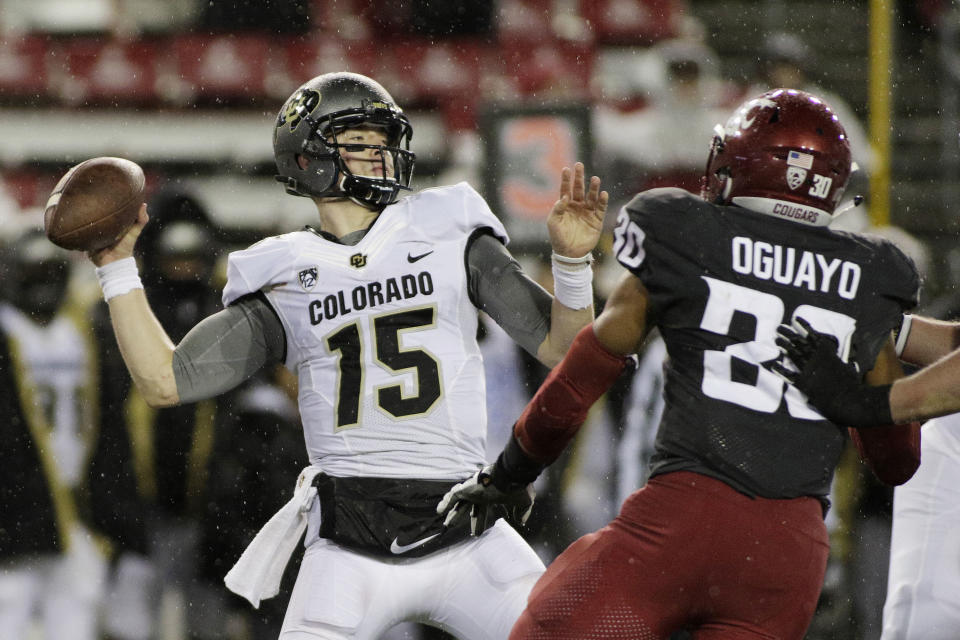 FILE - In this Saturday, Oct. 21, 2017, file photo, Colorado quarterback Sam Noyer (15) throws a pass during the second half of an NCAA college football game against Washington State in Pullman, Wash. Senior Sam Noyer packed up his stuff and left campus. The Colorado Buffaloes quarterback turned safety wanted to be a QB again and was exploring options through the graduate transfer portal. Then, a call from the new coaching staff. Now, he's back and in the mix to be the starting quarterback for the Buffaloes. (AP Photo/Young Kwak, File)