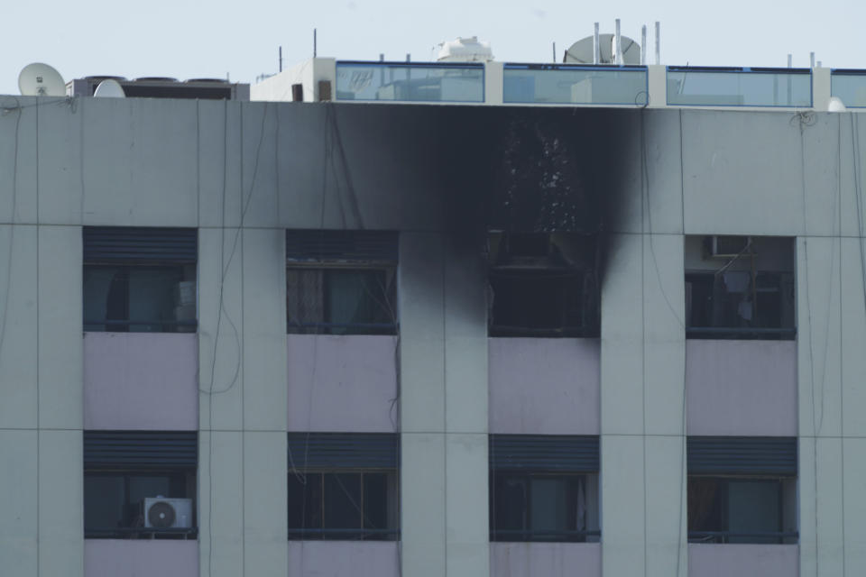 Char marks are seen after an apartment fire in Dubai, United Arab Emirates, Sunday, April 16, 2023. A fire swept through an apartment building in an older neighborhood of Dubai in the United Arab Emirates, killing multiple people and injuring another several, authorities said Sunday. (AP Photo/Jon Gambrell)