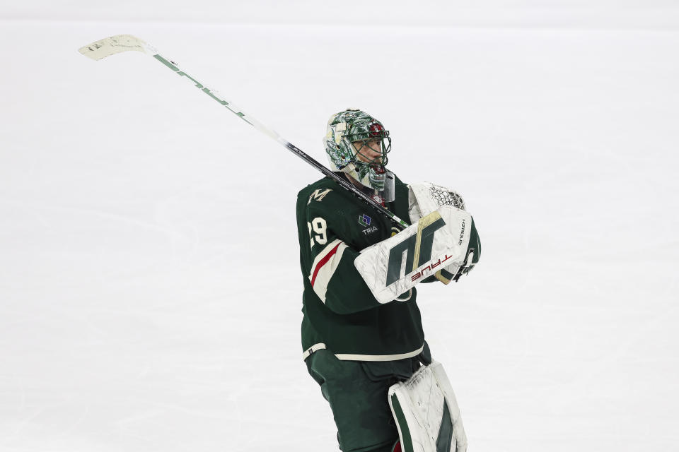 Minnesota Wild goaltender Marc-Andre Fleury reacts after winning an NHL hockey game against the New York Islanders, Monday, Jan. 15, 2024, in St. Paul, Minn. Fleury passed Patrick Roy for second place on NHL career wins with 552. (AP Photo/Stacy Bengs)