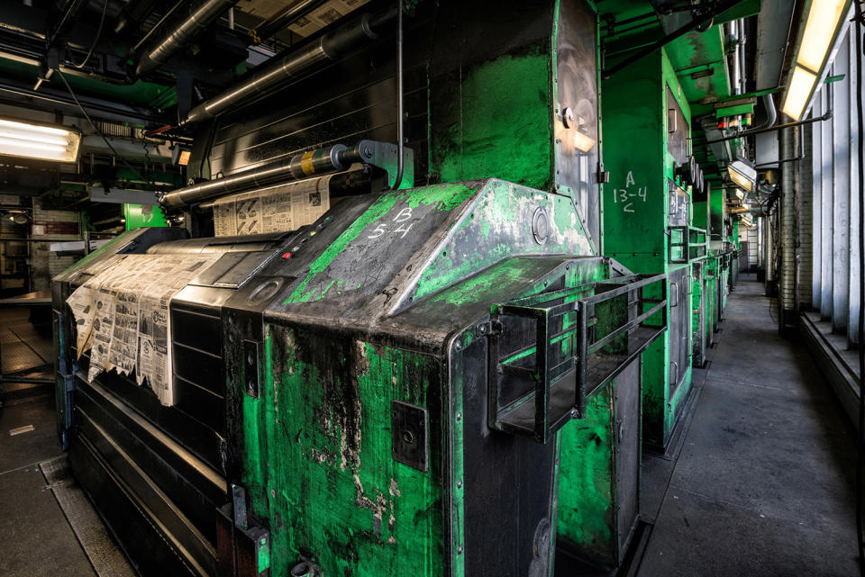 Stop the presses! Photographer documents newspaper’s eerie abandoned printing presses.