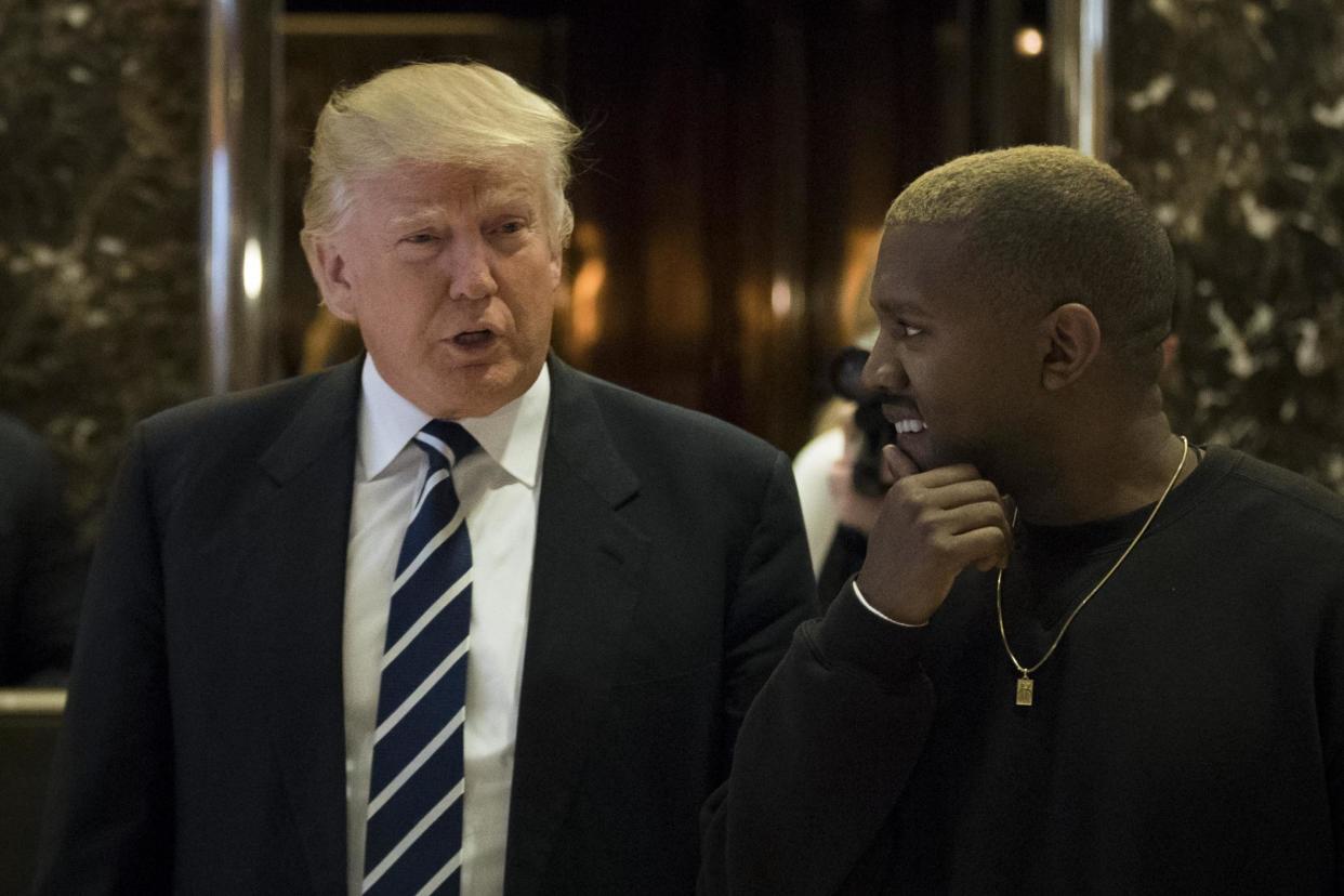 Donald Trump and Kanye West walk into the lobby at Trump Tower in 2016: Getty Images