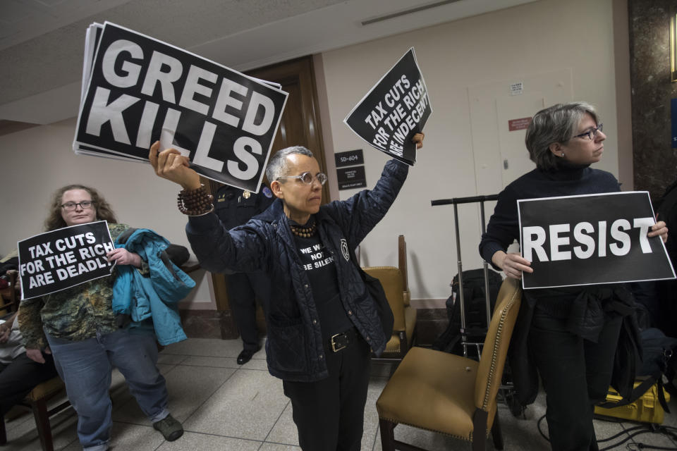 <p>Protesters shout their disapproval of the Republican tax bill outside the Senate Budget Committee hearing room on Capitol Hill in Washington, Tuesday, Nov. 28, 2017. (Photo: J. Scott Applewhite/AP) </p>