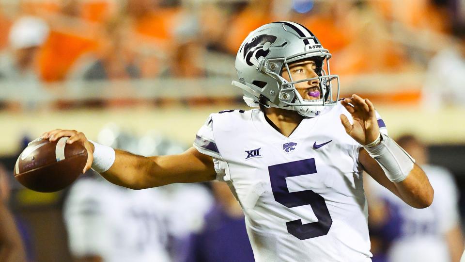 Kansas State quarterback Jaren Lewis (5) throws a pass during an NCAA college football game against Oklahoma State, Saturday, Sept. 25, 2021, in Stillwater, Okla. (AP Photo/Brody Schmidt)