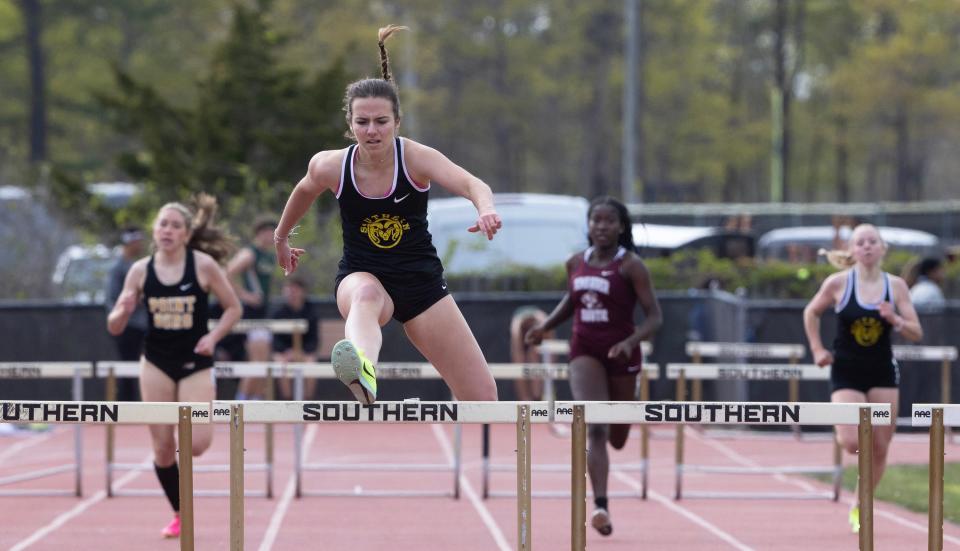 Southern Regional Grace Fessler  clear the hurdle as she heads to the finish line for a first place win in 3X400 Hurdles. Ocean County Track and Field Relays in Stafford Township on May 5, 2023.