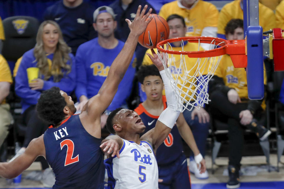 Virginia's Braxton Key (2) defends as Pittsburgh's Au'Diese Toney (5) shoots during the second half of an NCAA college basketball game, Saturday, Feb. 22, 2020, in Pittsburgh. Virginia won 59-56. (AP Photo/Keith Srakocic)