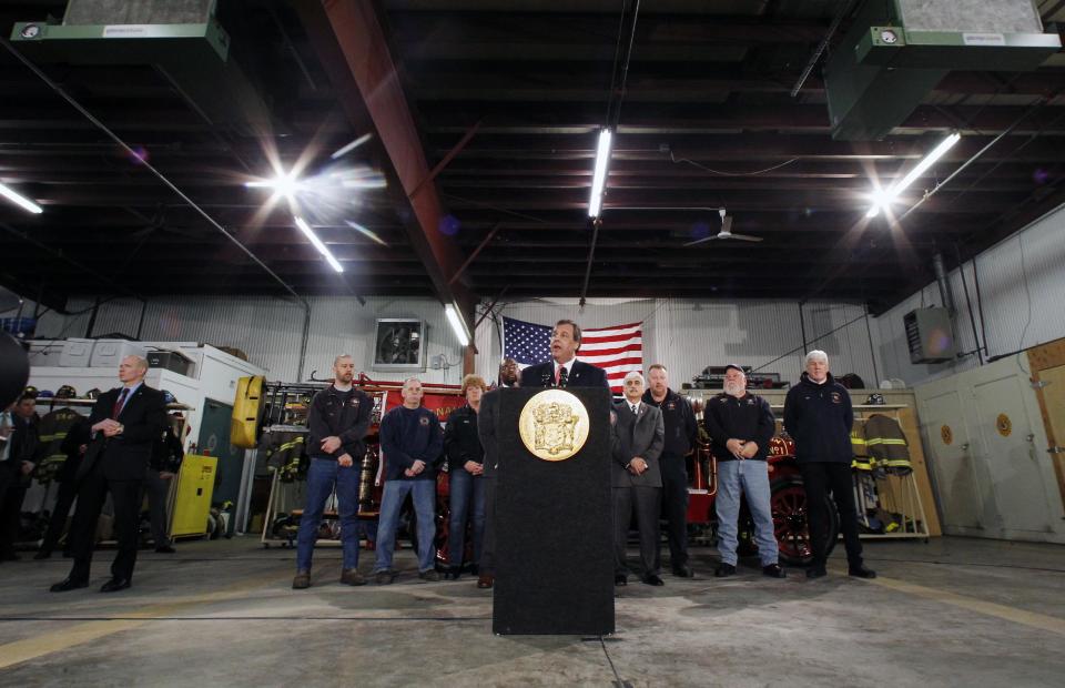 New Jersey Gov. Chris Christie addresses a gathering of home owners Thursday, Jan. 16, 2014, in Manahawkin, N.J., who were affected by last year's Superstorm Sandy. Christie spoke to Superstorm Sandy victims one week after the meeting was hastily canceled because of a scandal over traffic jams that appear to have been manufactured by his aides. Christie and Community Affairs Commissioner Richard Constable III announced a Sandy housing recovery milestone Thursday as the governor seeks to put the traffic scandal behind him. (AP Photo/Mel Evans)