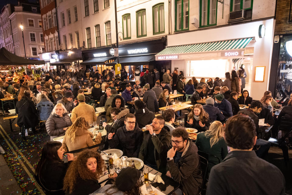 People gather in Soho, London, where streets were closed to traffic as bars and restaurants opened for outside eating and drinking, as lockdown measures are eased across the UK. Picture date: Tuesday April 13, 2021. Photo credit should read: Matt Crossick/Empics