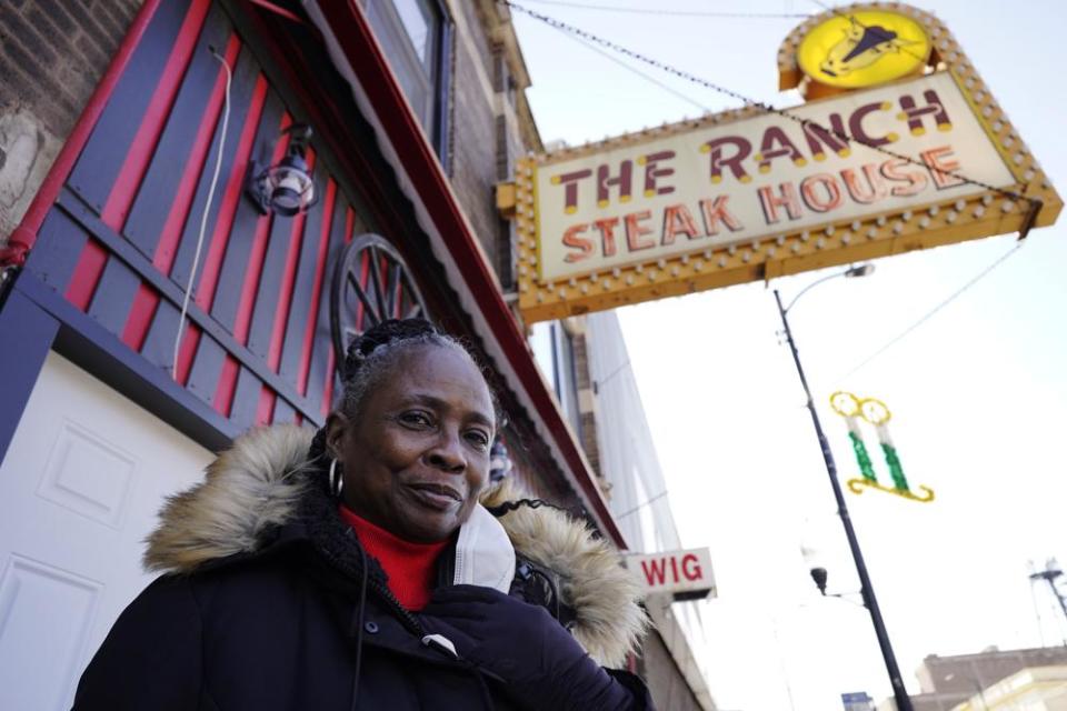 Judy Ware poses for a photo outside of her restaurant in Chicago, Thursday, Jan. 20, 2022. (AP Photo/Nam Y. Huh)